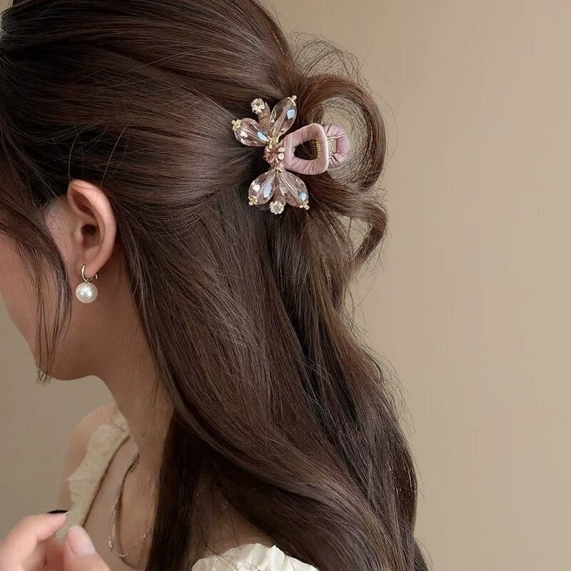 Blush butterfly crystal hair clip styled in half-up hair