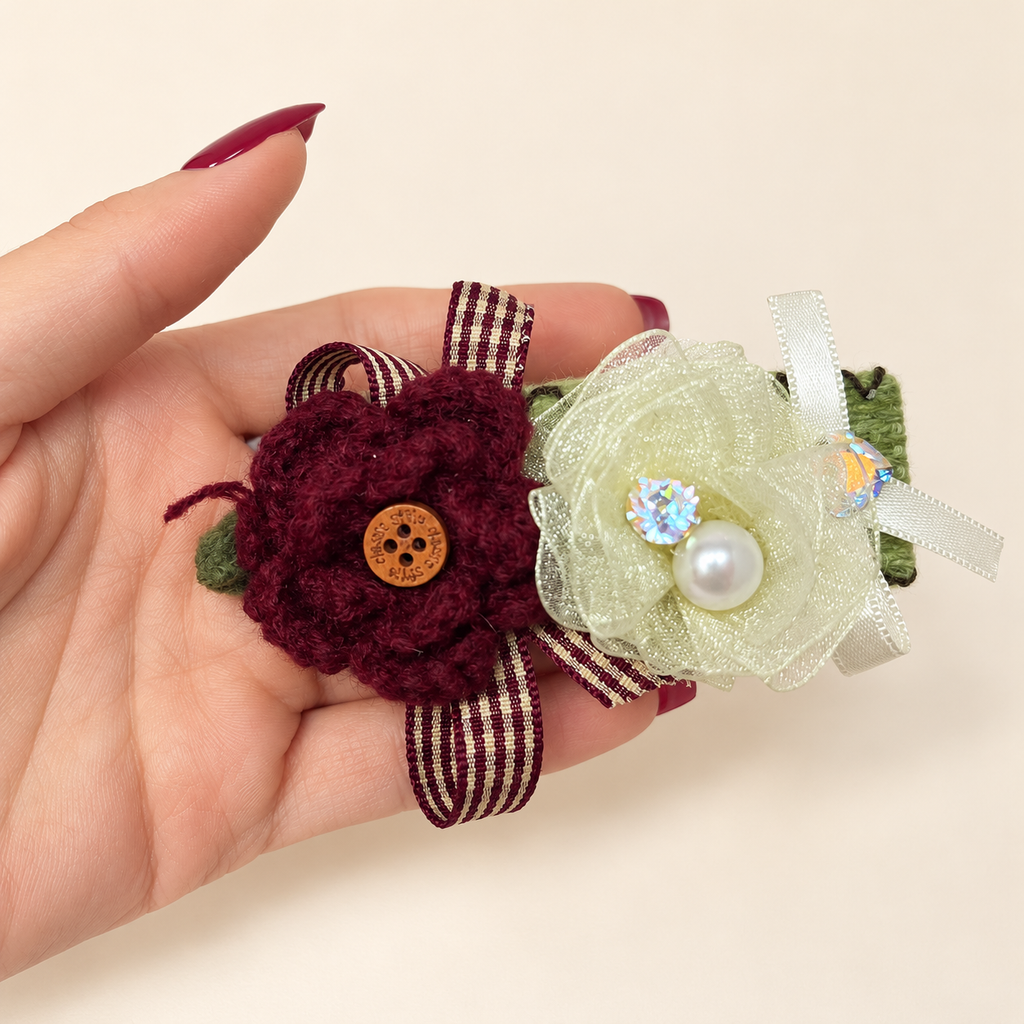 Handmade burgundy yarn flower and sheer ivory flower hair clip with striped ribbon and pearl-style bead