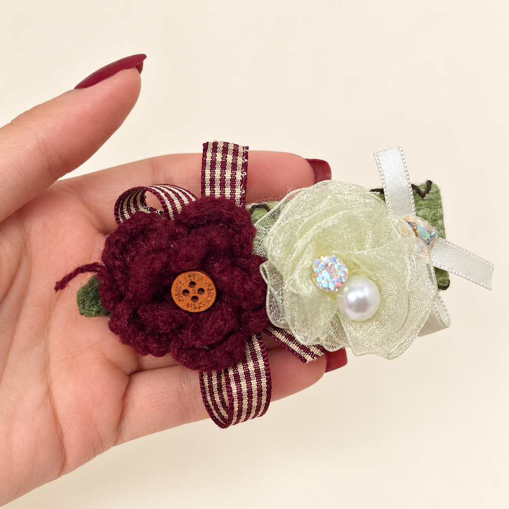 Handmade burgundy yarn flower and sheer ivory flower hair clip with striped ribbon and pearl-style bead