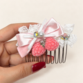 Pink berry lace hair comb with light-pink silvery ribbon bow and pearl-style accents