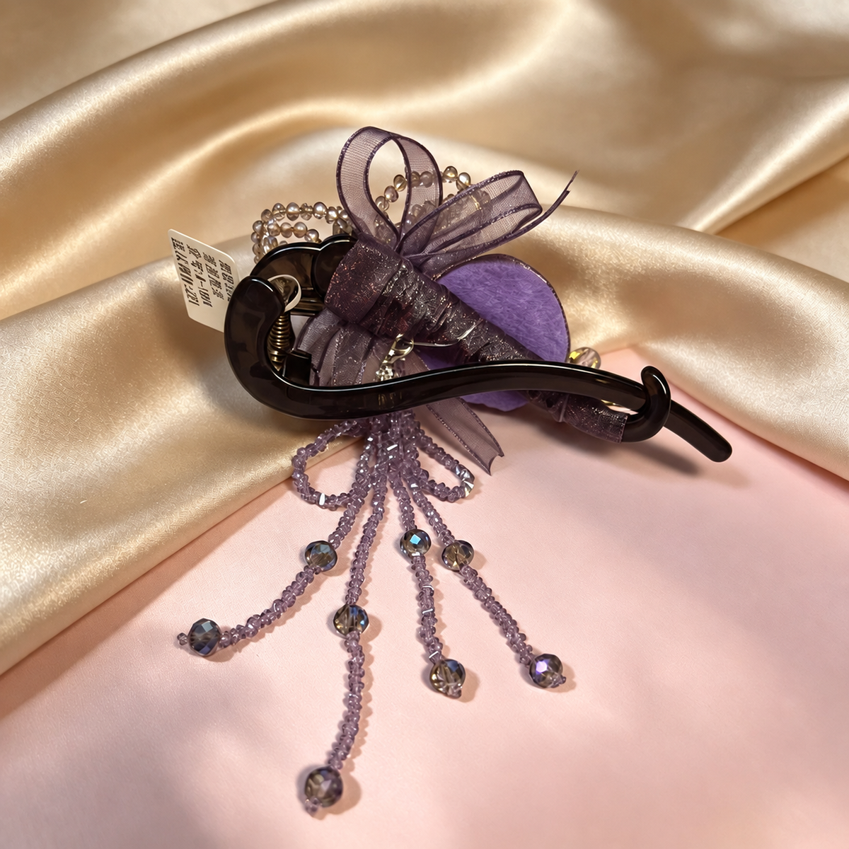 Back view of purple rose hair clip with removable beaded dangle
