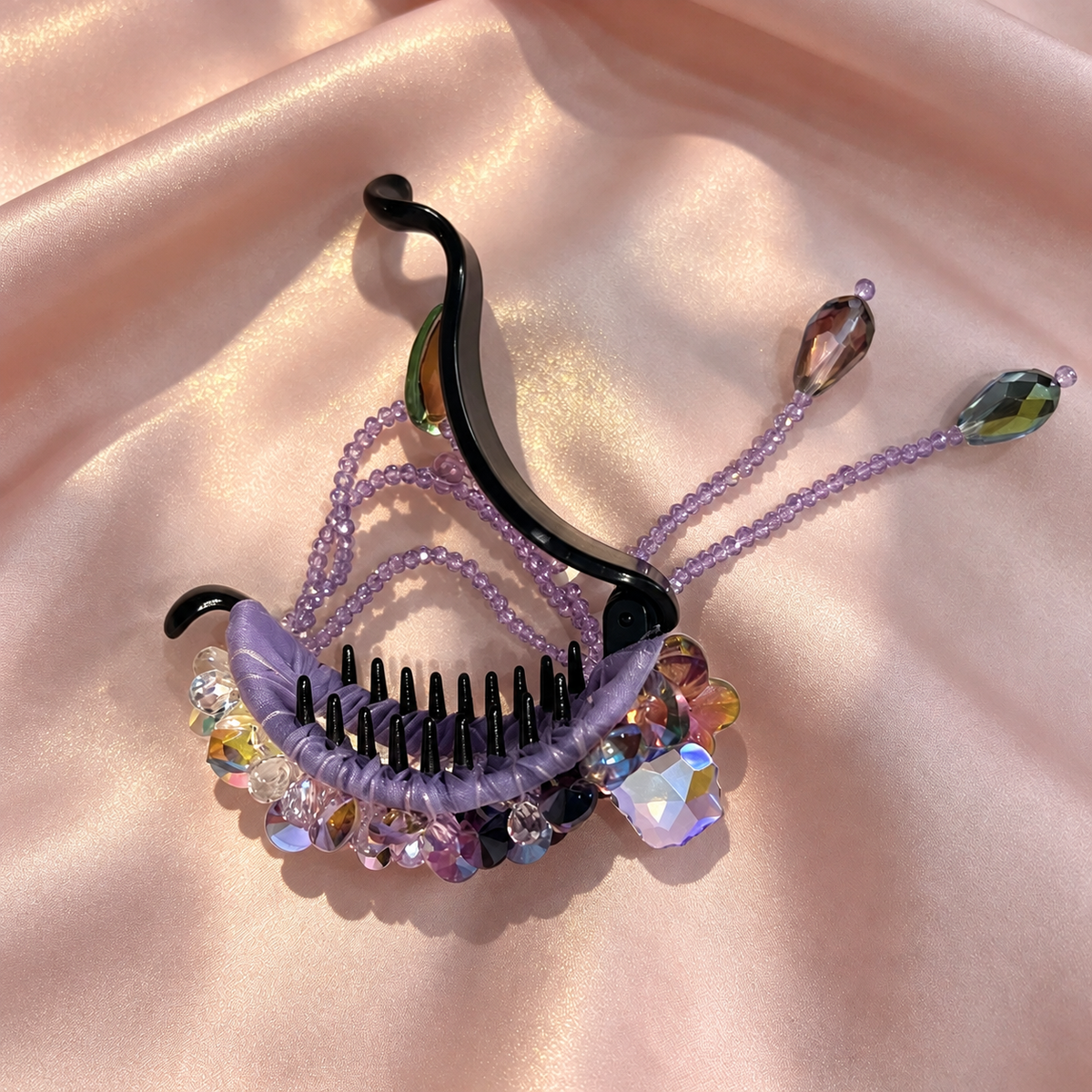 Open lavender beaded hair claw with attached purple chains