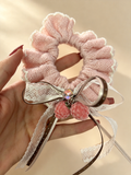 Pink lace bow scrunchie with brown ribbons and two berry charms - view 2
